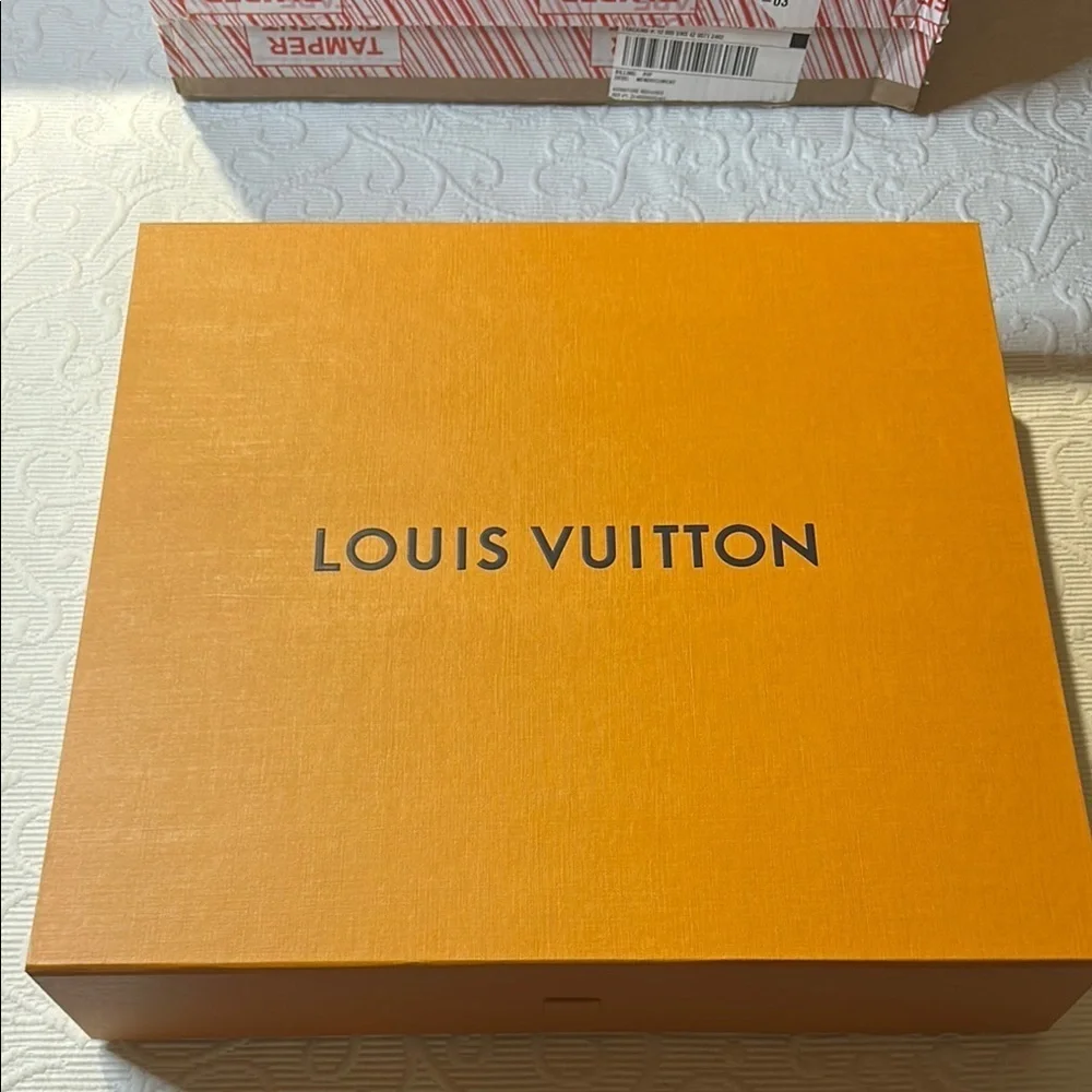 Louis Vuitton Signature  Box inside a LV shipping box with tissue and ribbon.
